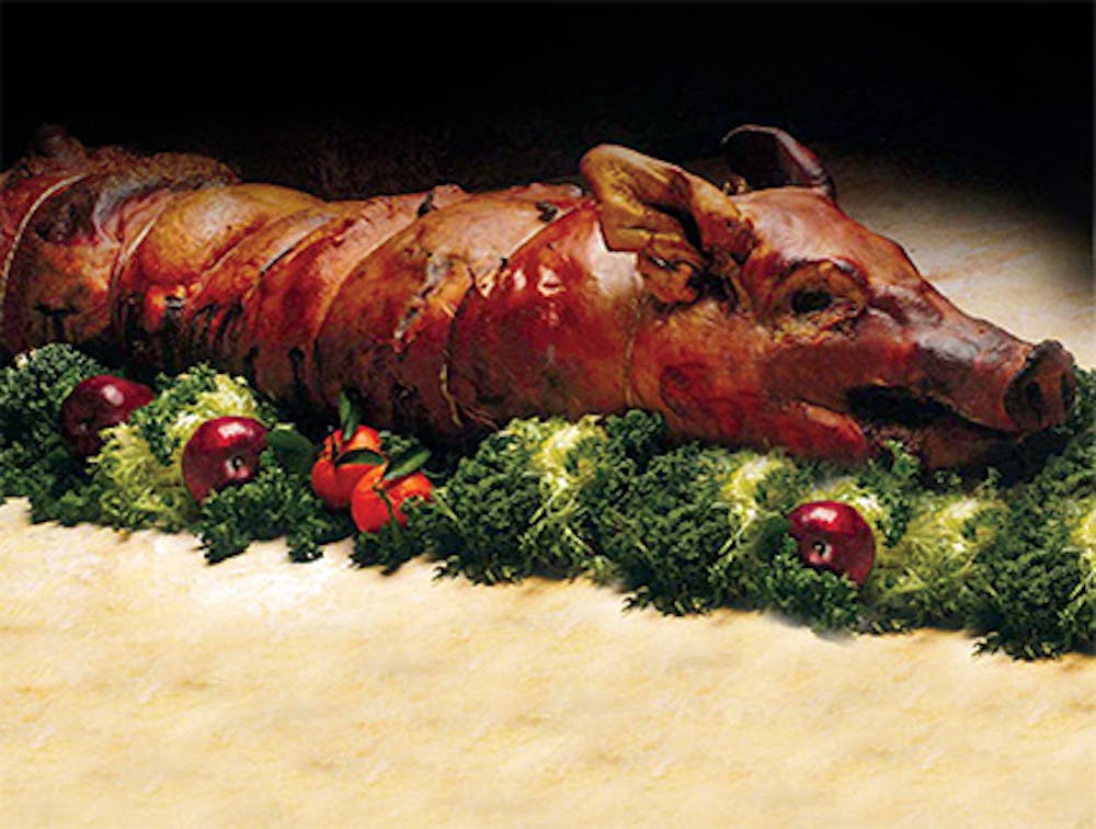 Latin whole suckling pig roast served by Cuban food caterers near Murray Hill, Manhattan, New York.