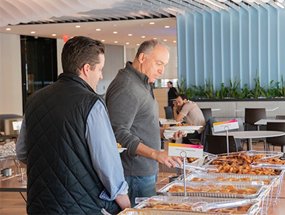 Guests enjoying delicious Cuban dishes served by Havana Central's Cuban food catering near Roosevelt Field, Garden City, NY.