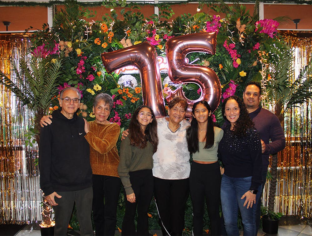 Family members hosting party at the Lincoln Square, Manhattan birthday celebration space at Havana Central.