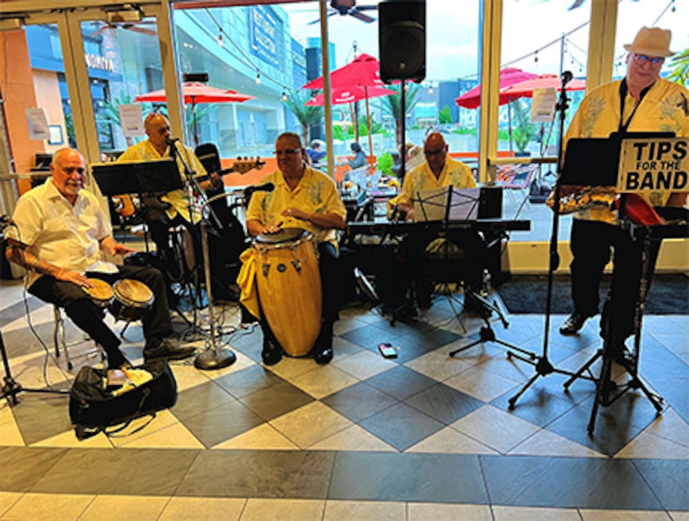 Five musicians performing live Latin music near Garden City Park, NY.