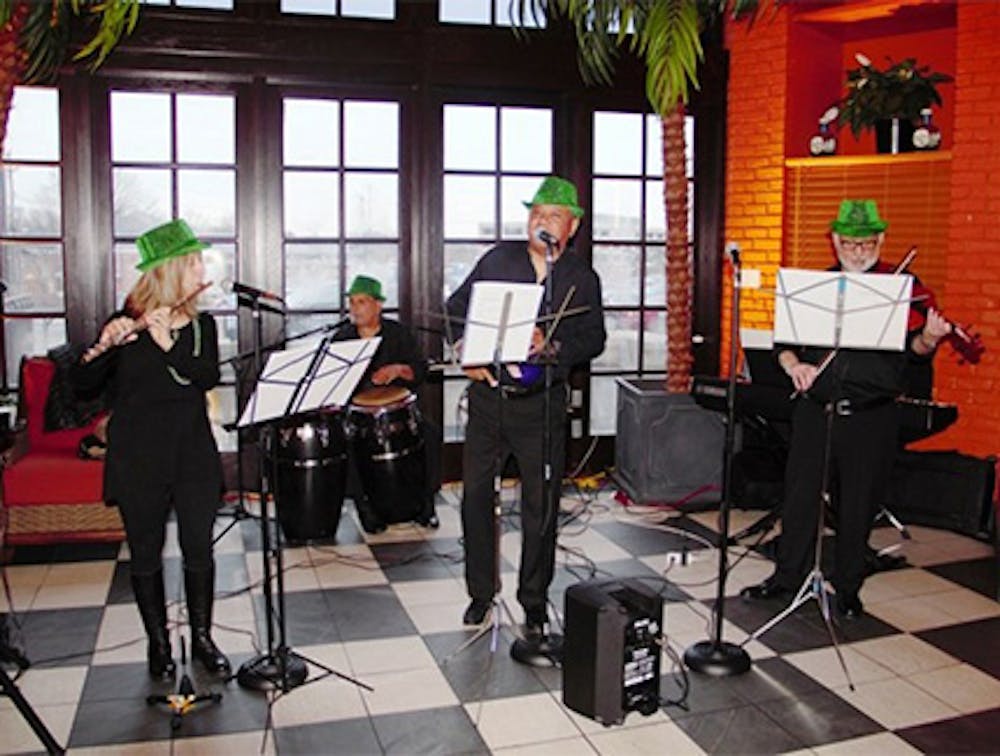 Four musicians performing live Latin music near Clara Barton, NJ.