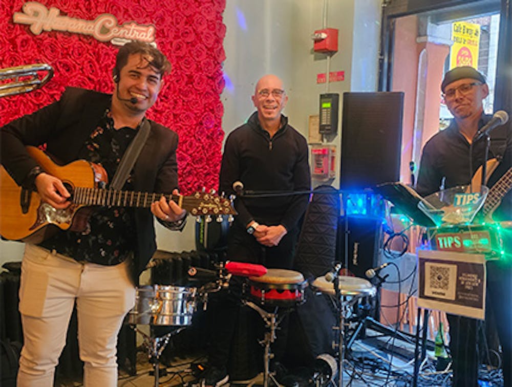 Three musicians at our Hell's Kitchen live music restaurant.