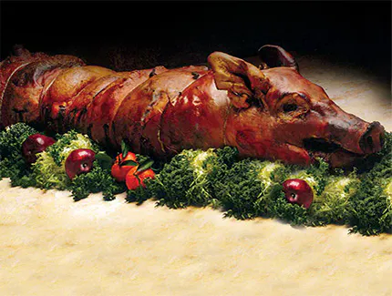 Latin whole suckling pig roast served by Cuban food caterers near Hell's Kitchen, Manhattan, New York.