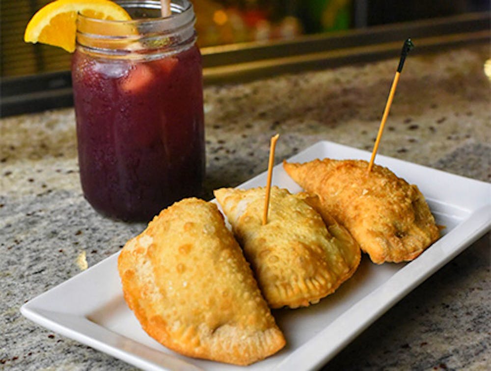 Empanadas and a cocktail, some of our Happy Hour specials near Central Park, Manhattan.