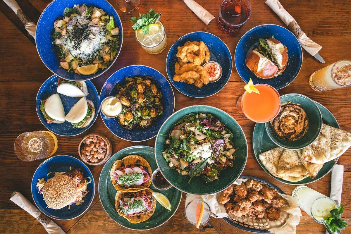 a bunch of food sitting on top of a wooden table