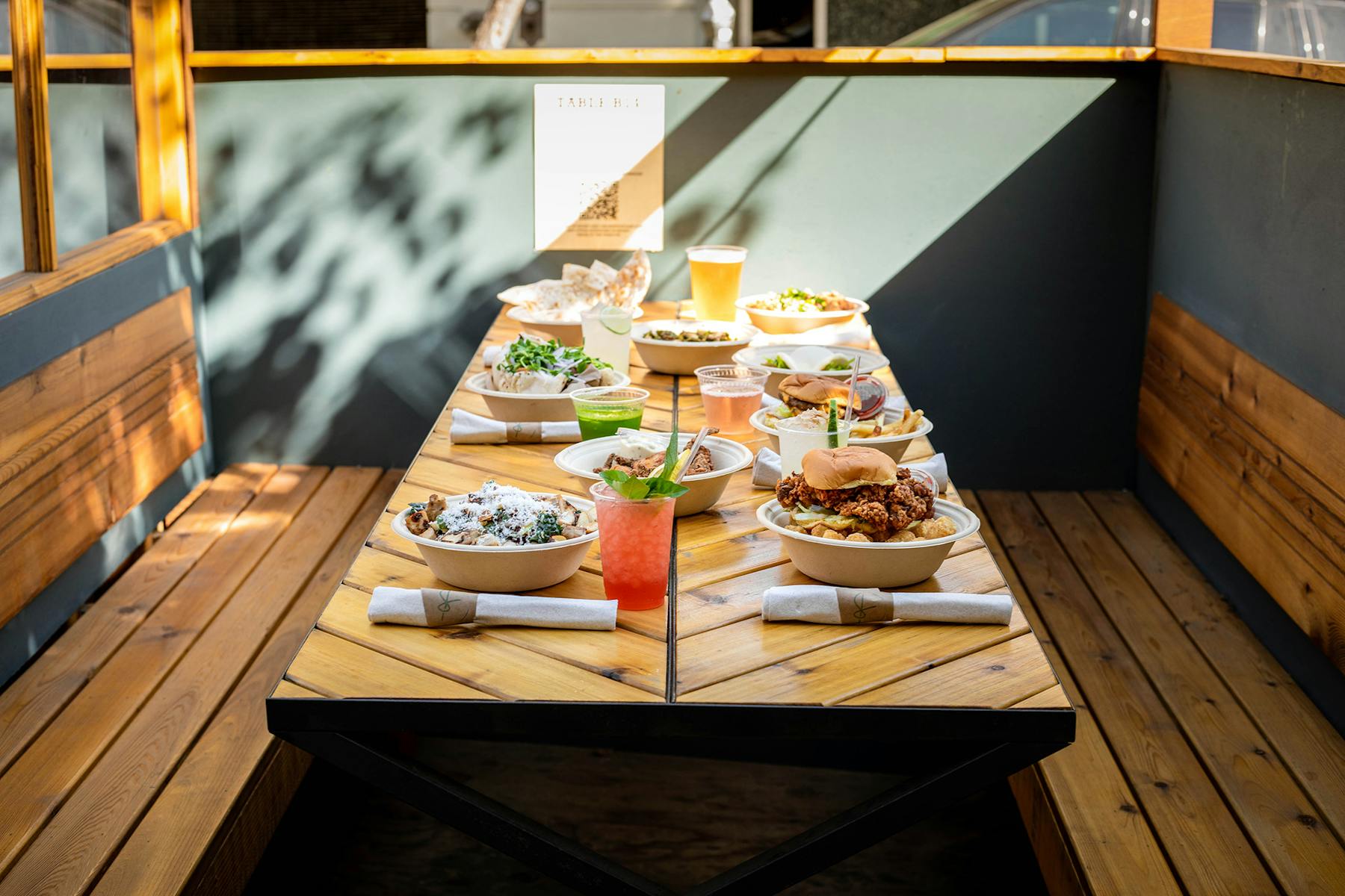 a pizza sitting on top of a wooden table