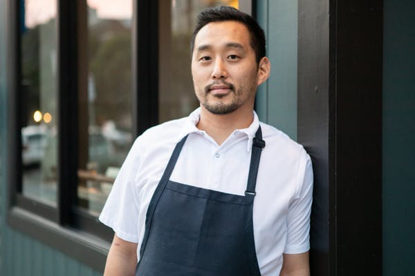 a man standing in front of a window