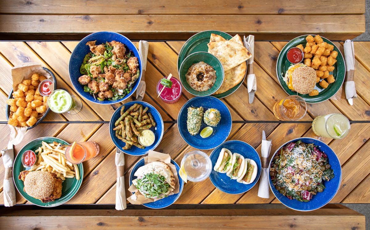 a bunch of food sitting on top of a wooden table