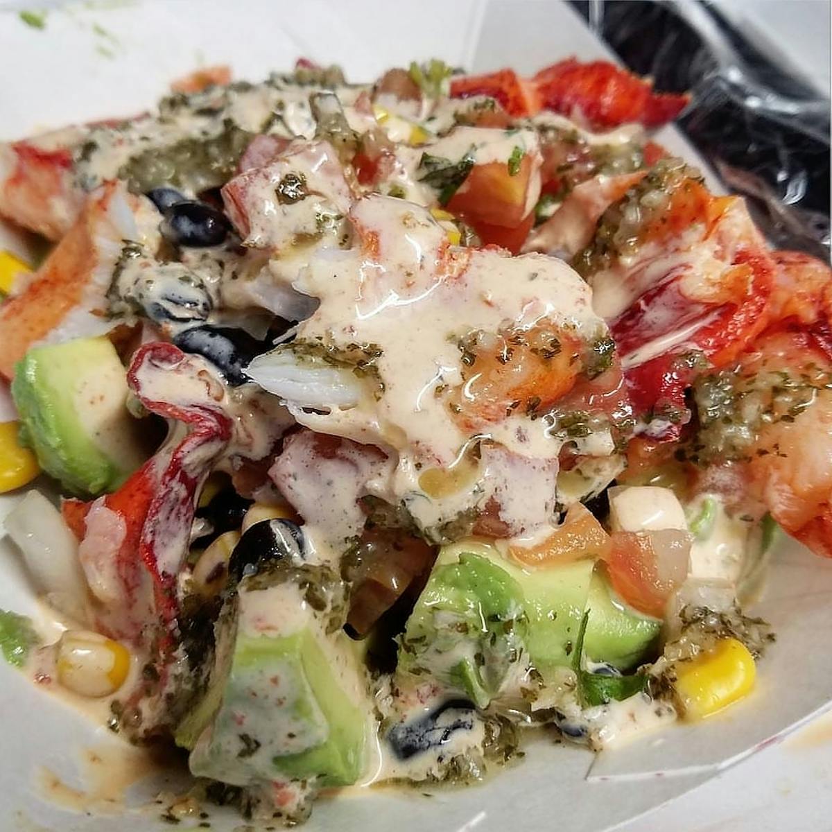 a close up of a lobster salad