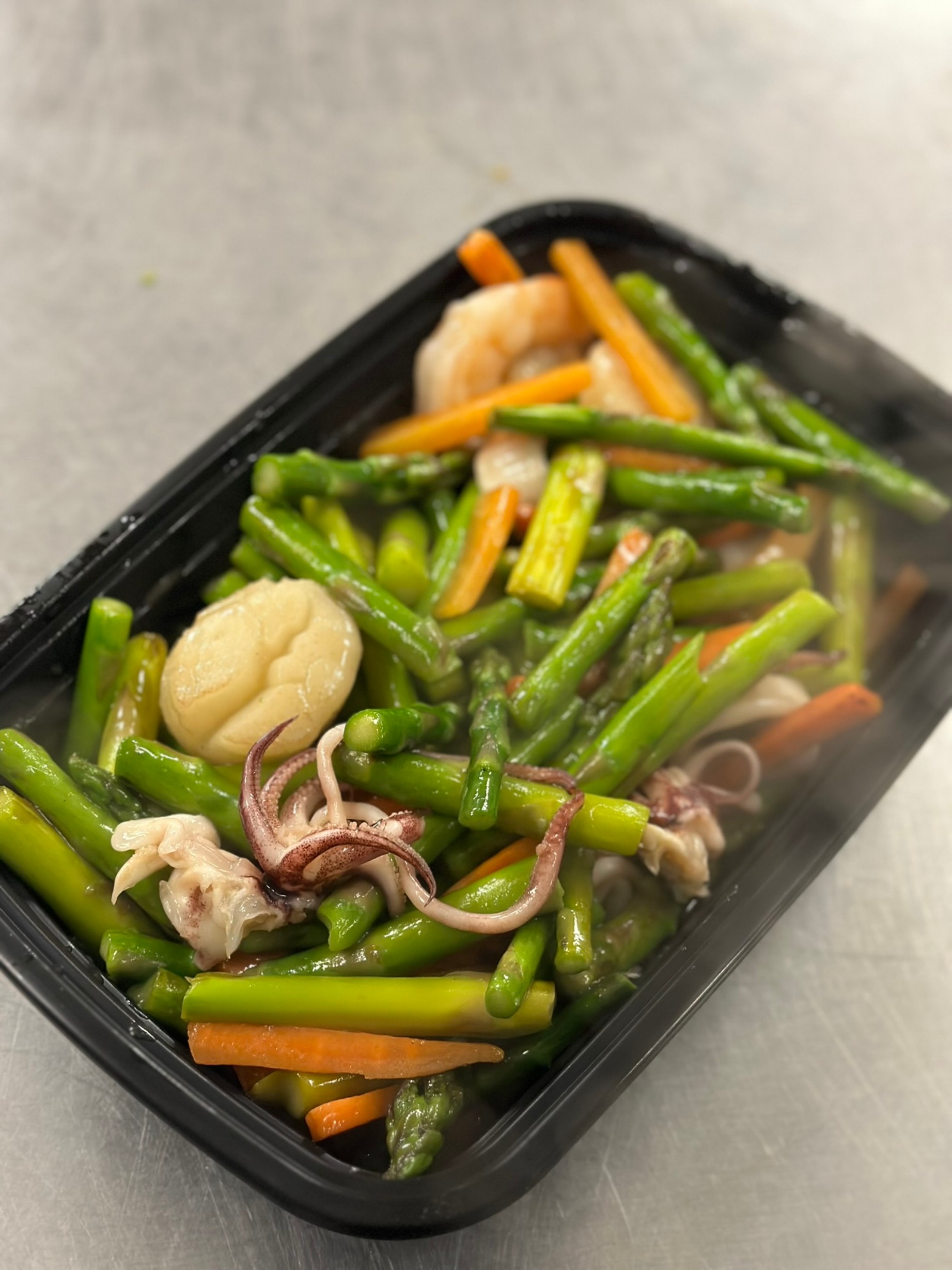 a tray of food with broccoli