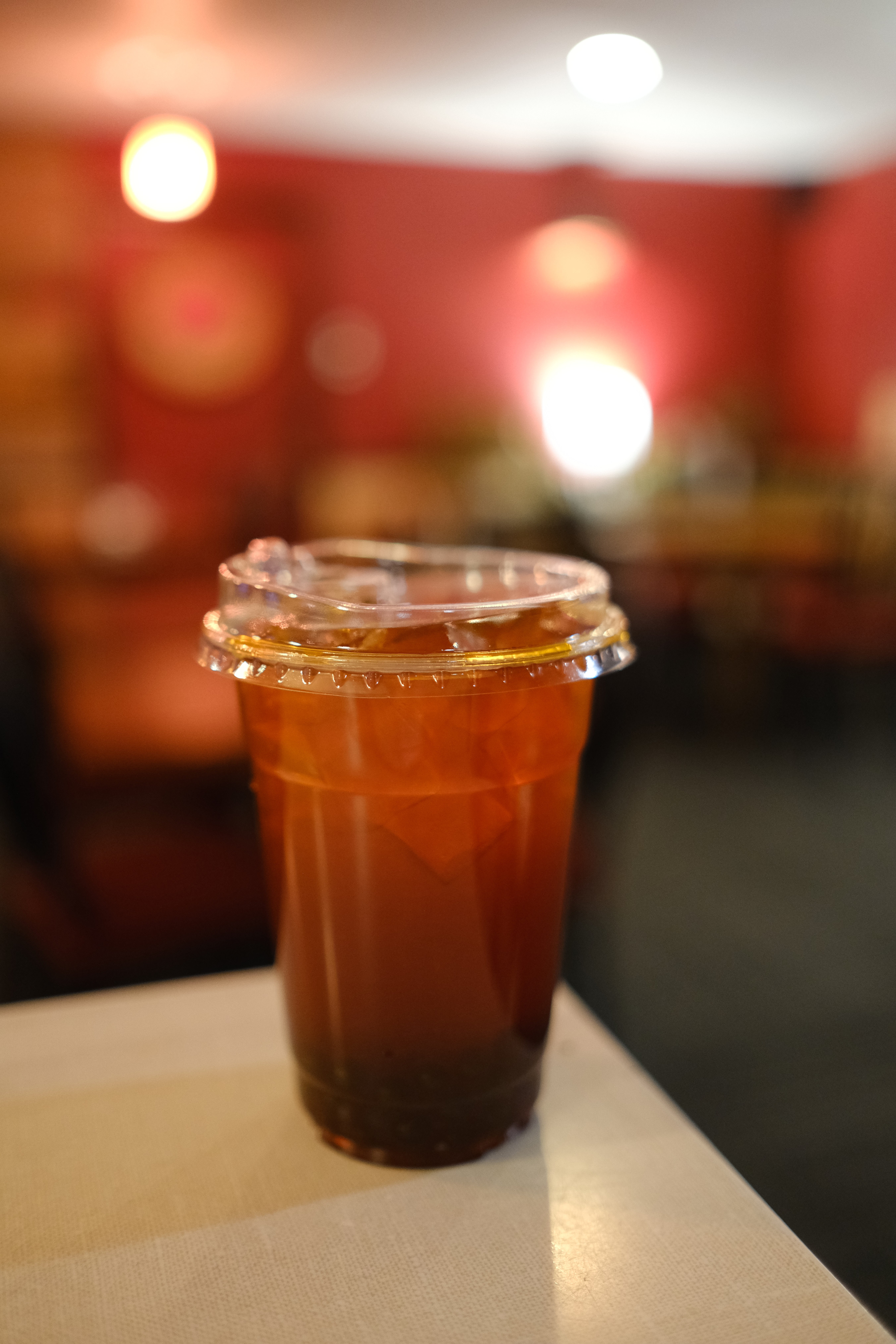 a close up of a glass of beer on a table