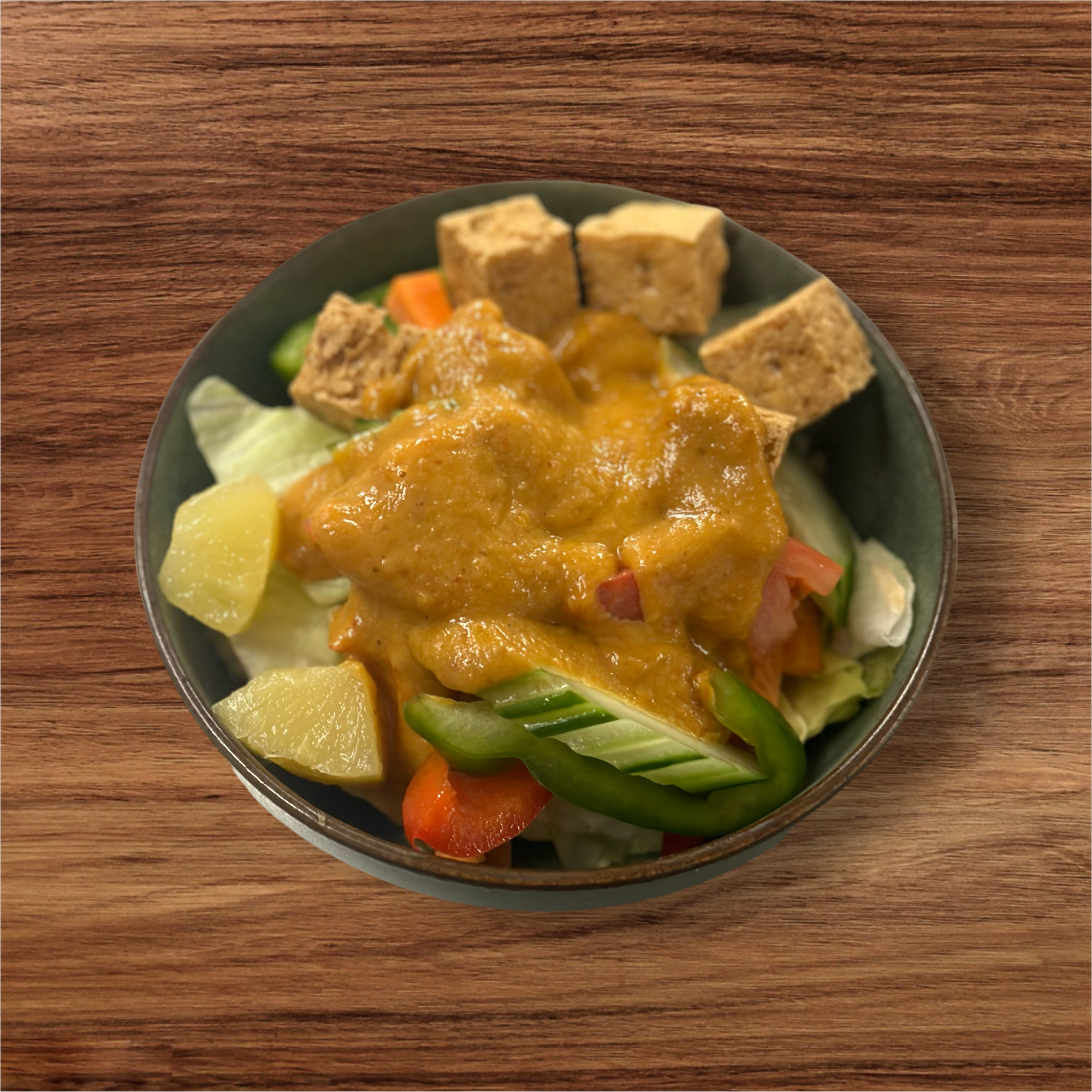 a plate of food on a wooden table