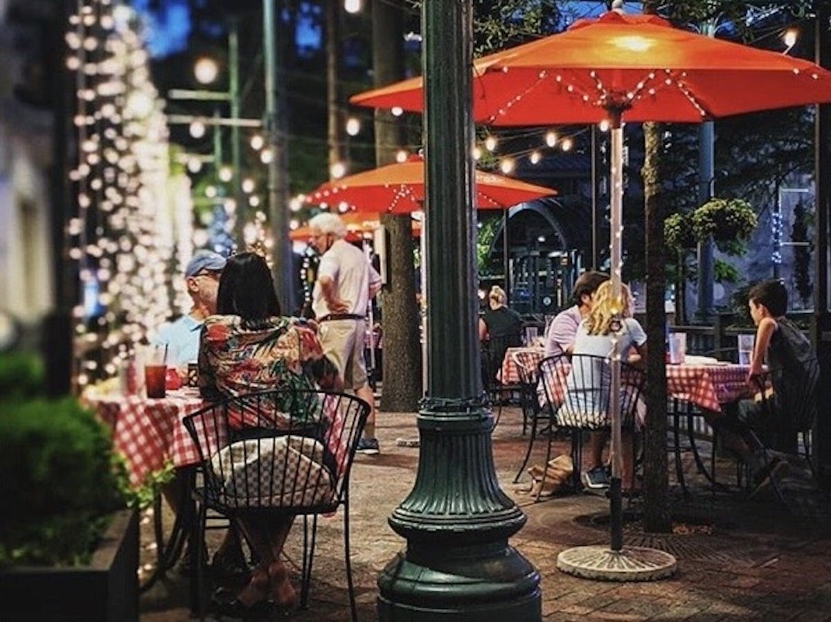 Diners enjoying Cocozza American Italian, the pop up on The Majestic Grille Patio in 2020