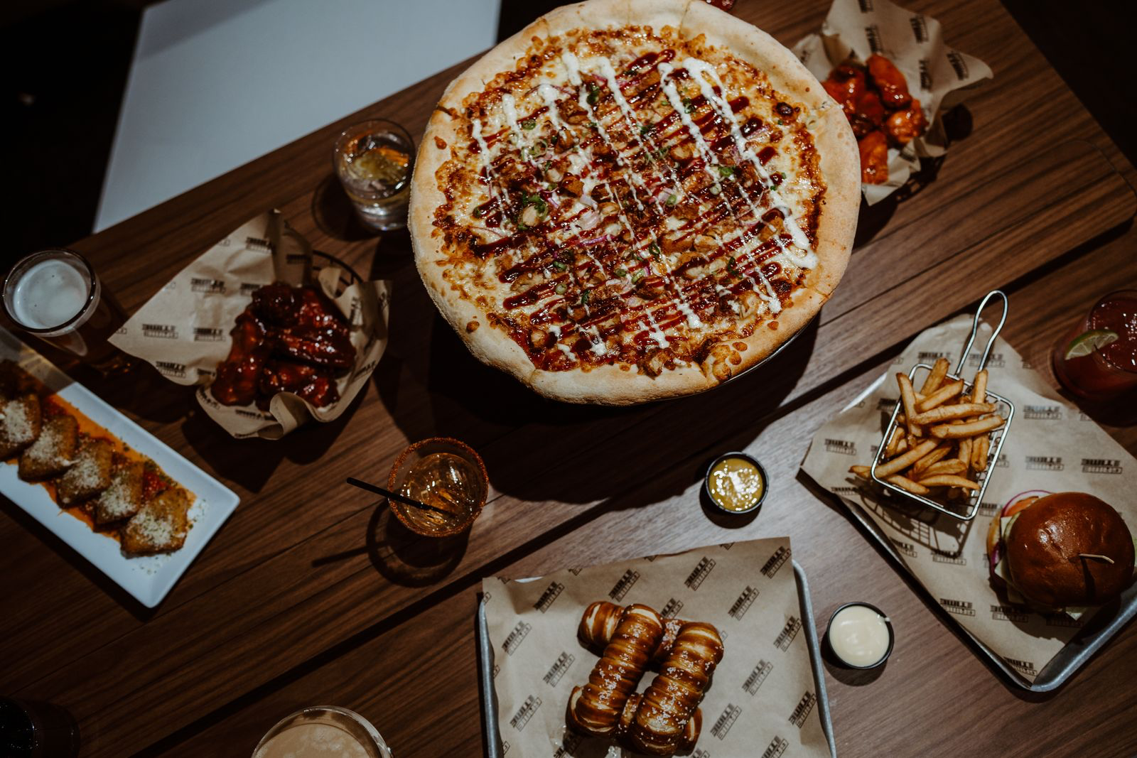 a bunch of food sitting on top of a wooden table