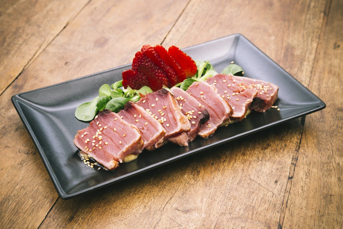 a plate of food sitting on top of a wooden floor