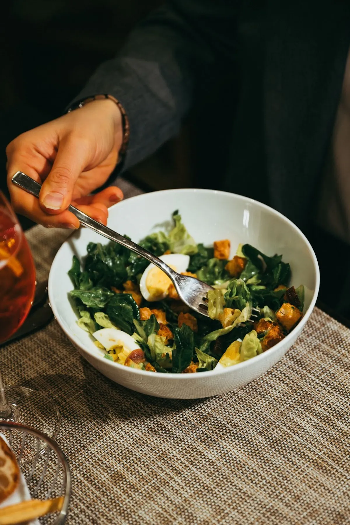 a person holding a bowl of food
