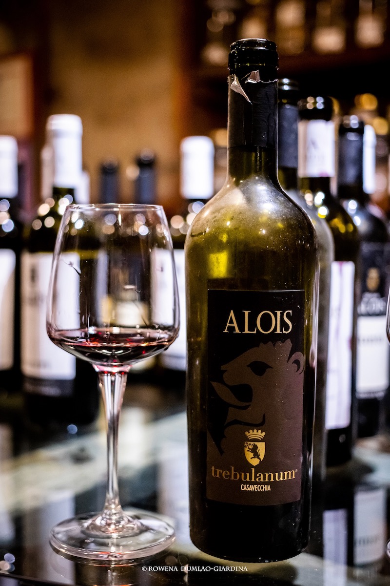 a wine bottle and a glass of wine