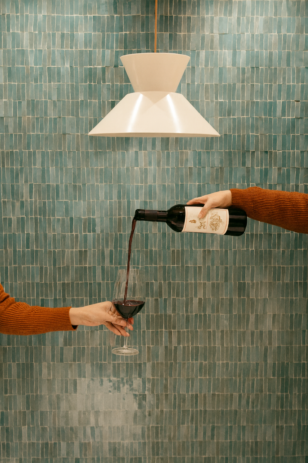 a person holding a wine glass