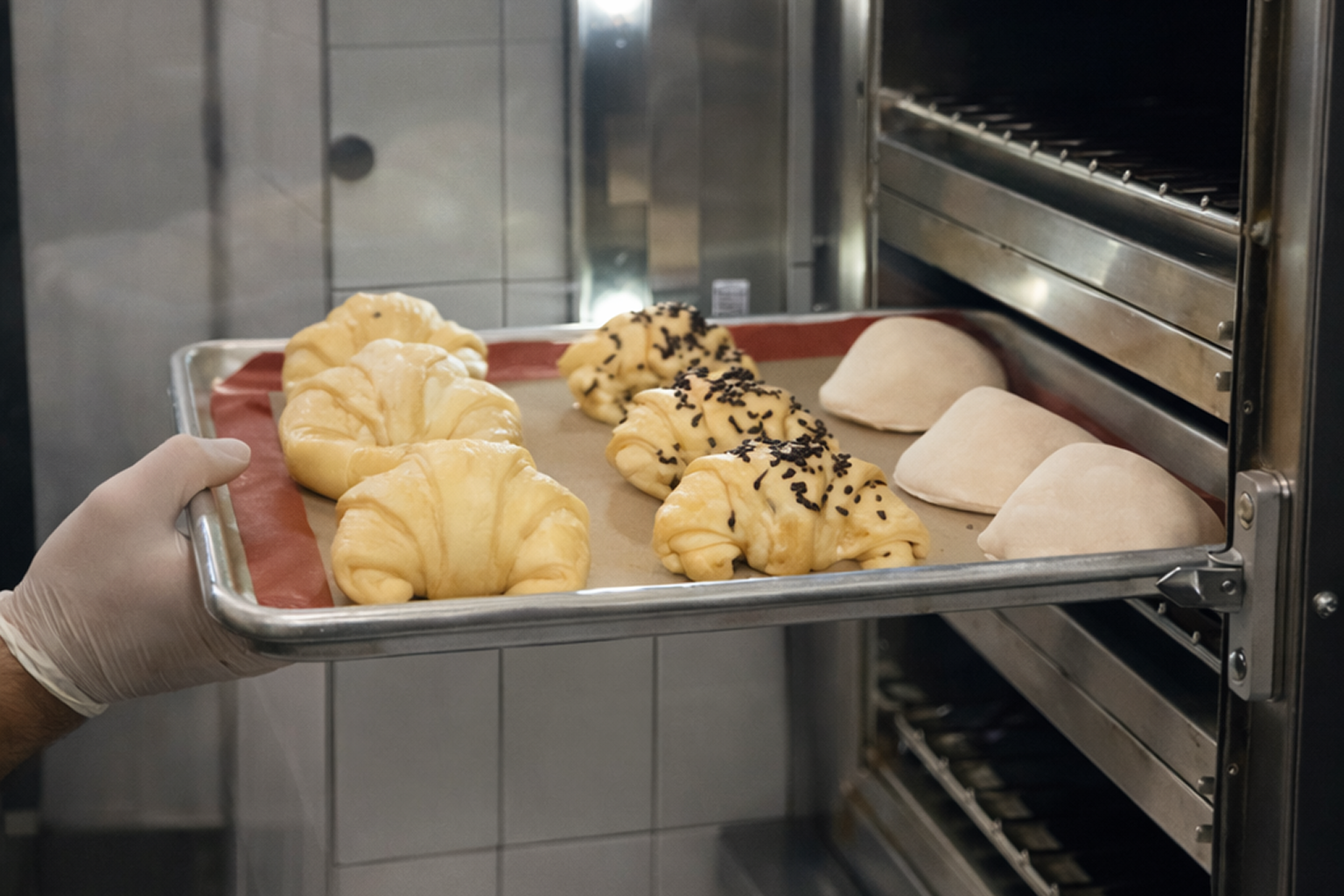 Pastry Chef baking fresh Cornetti.