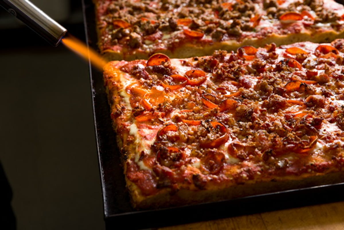 a pizza sitting on top of a table