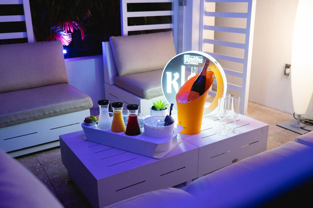 a bedroom with a computer on a table