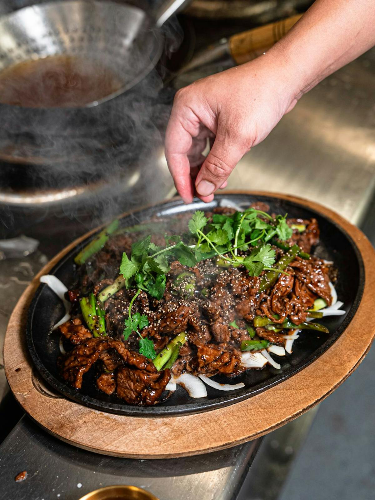 a person cooking food in a pan
