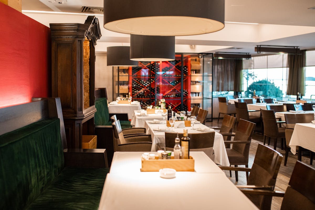 a living room filled with furniture and vase on a table