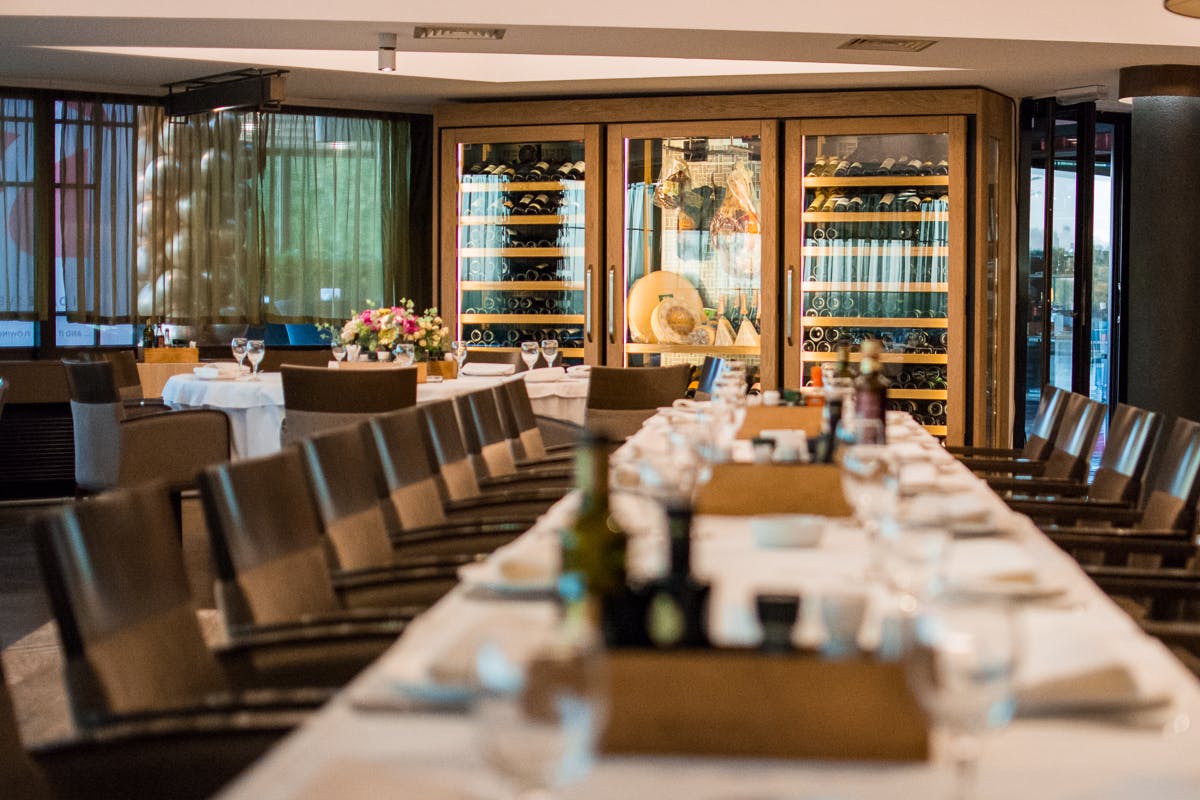 a dining room table in front of a window