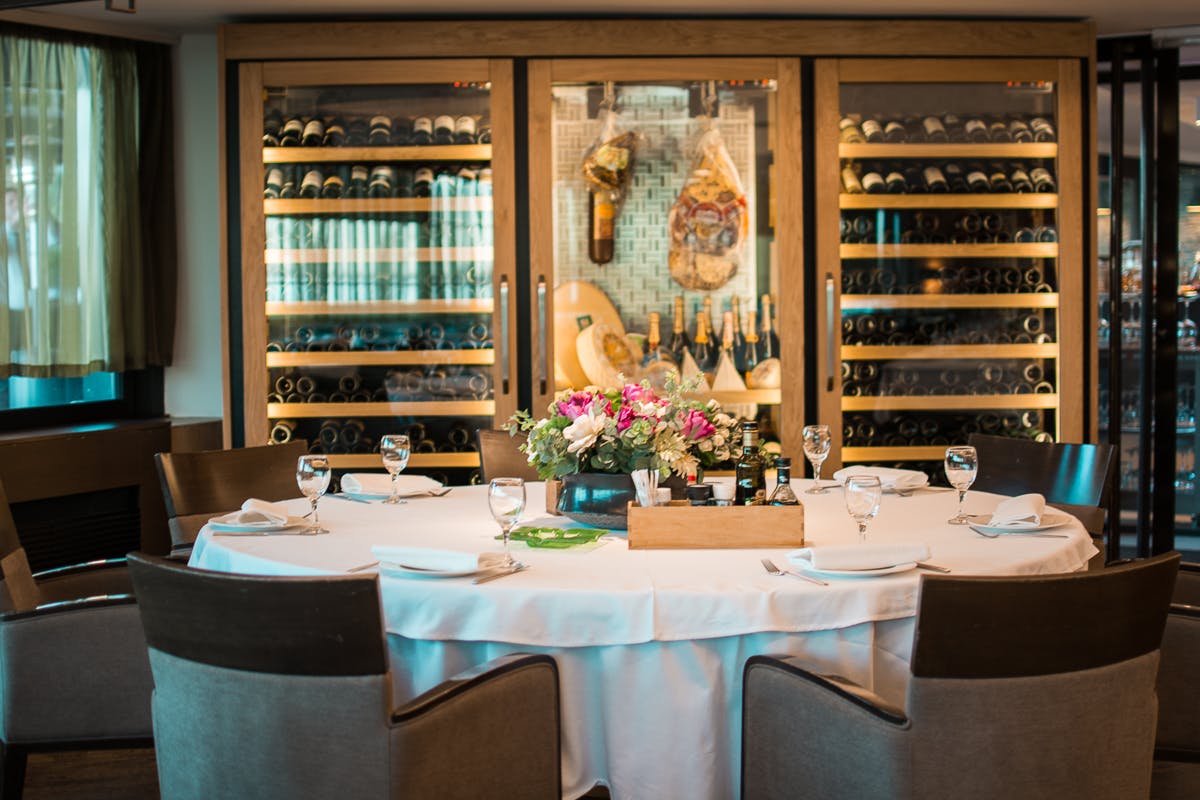 a dining room table in front of a window