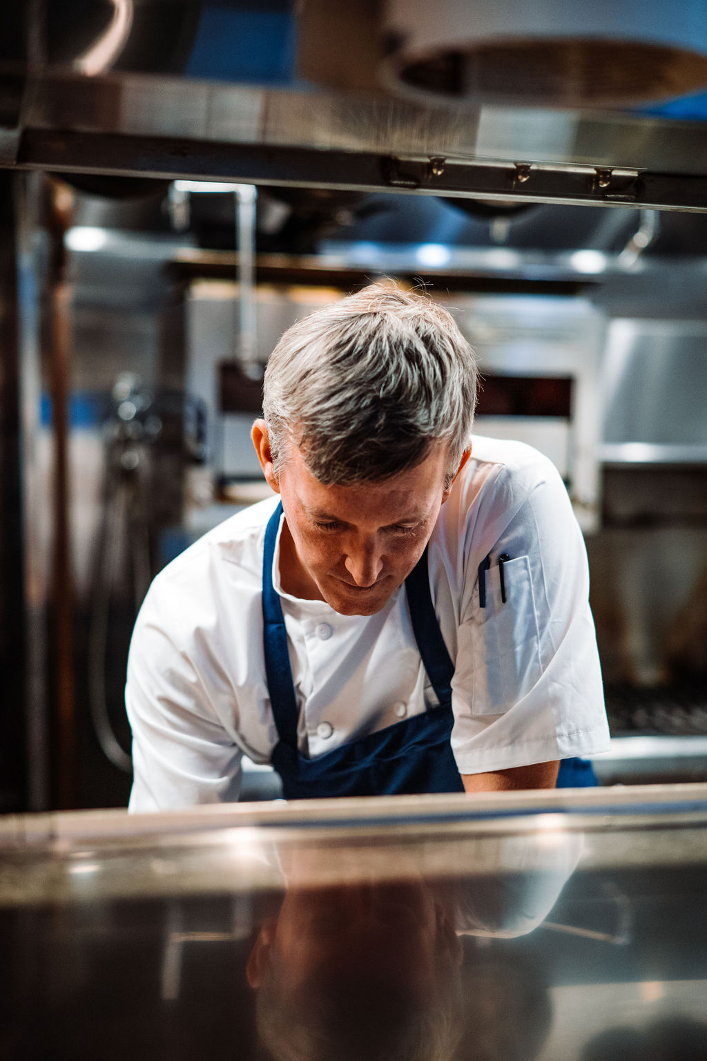 a man cooking in a kitchen