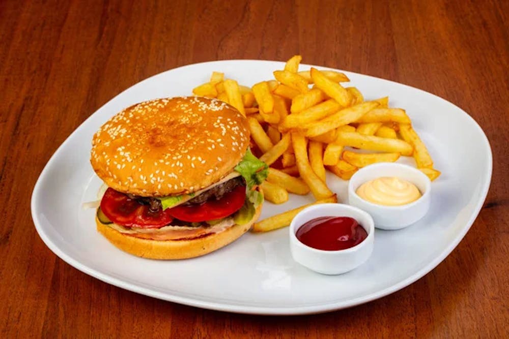 a table topped with a sandwich and fries on a plate