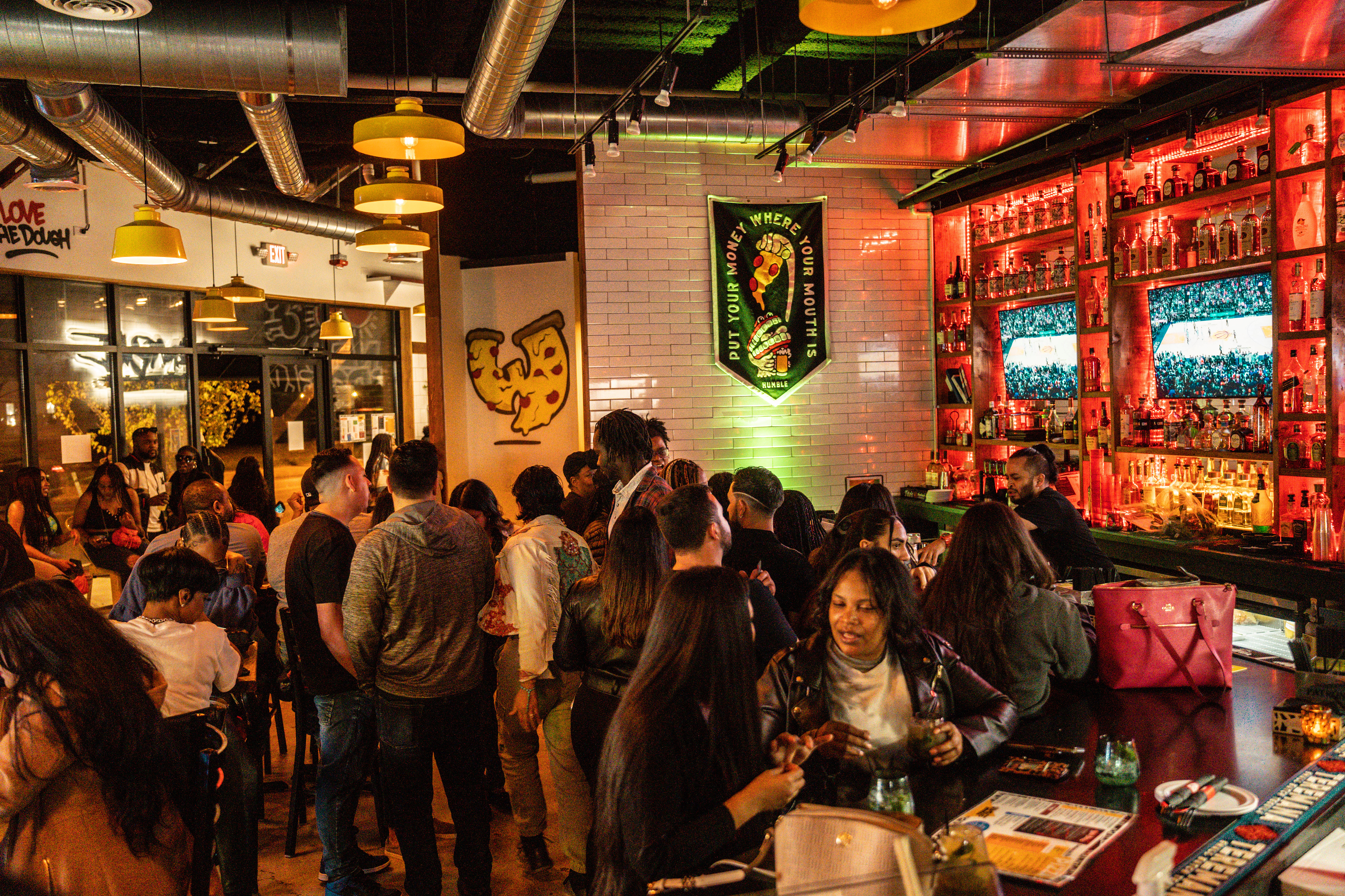 a group of people standing in front of a store