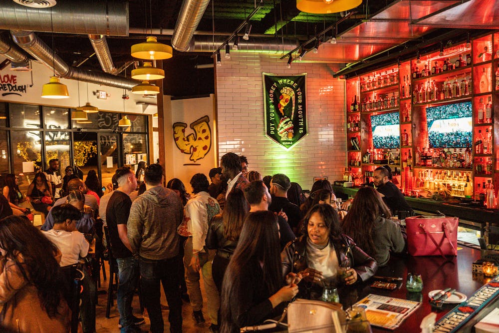 a group of people standing in front of a store