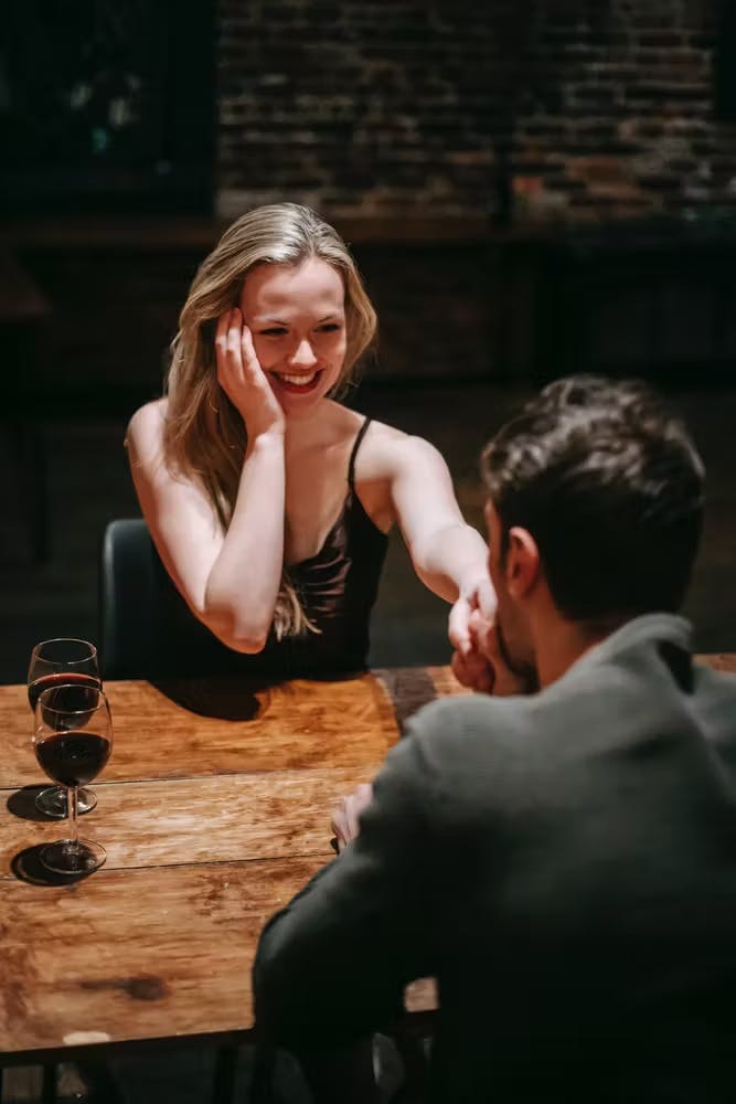 a woman sitting on a table