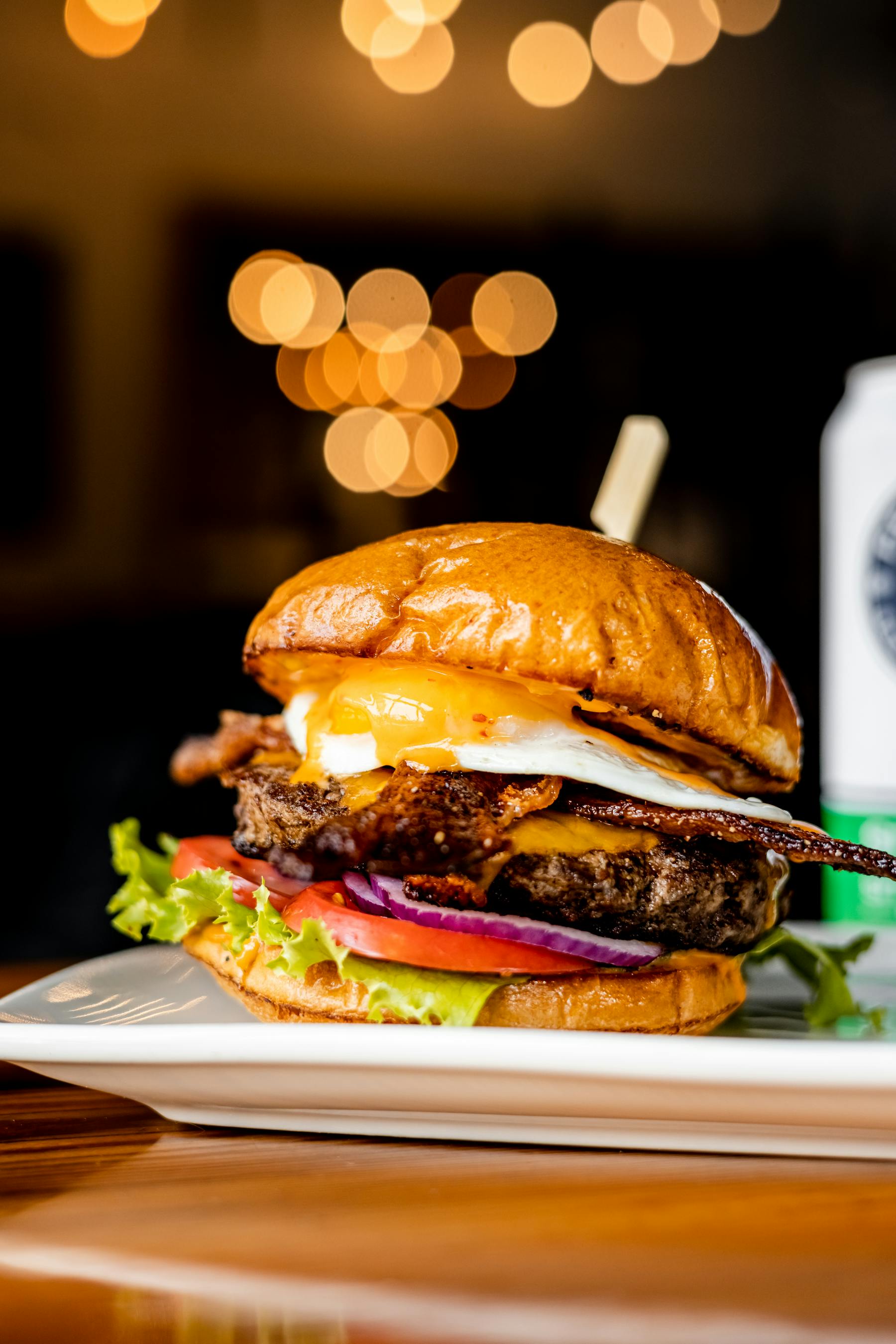 State & Allens juicy sunrise burger topped with an egg of your choice