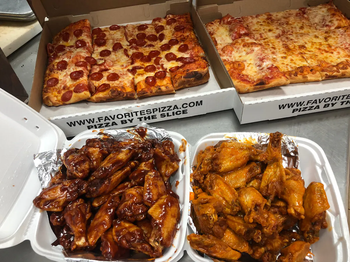 a box filled with different types of pizza