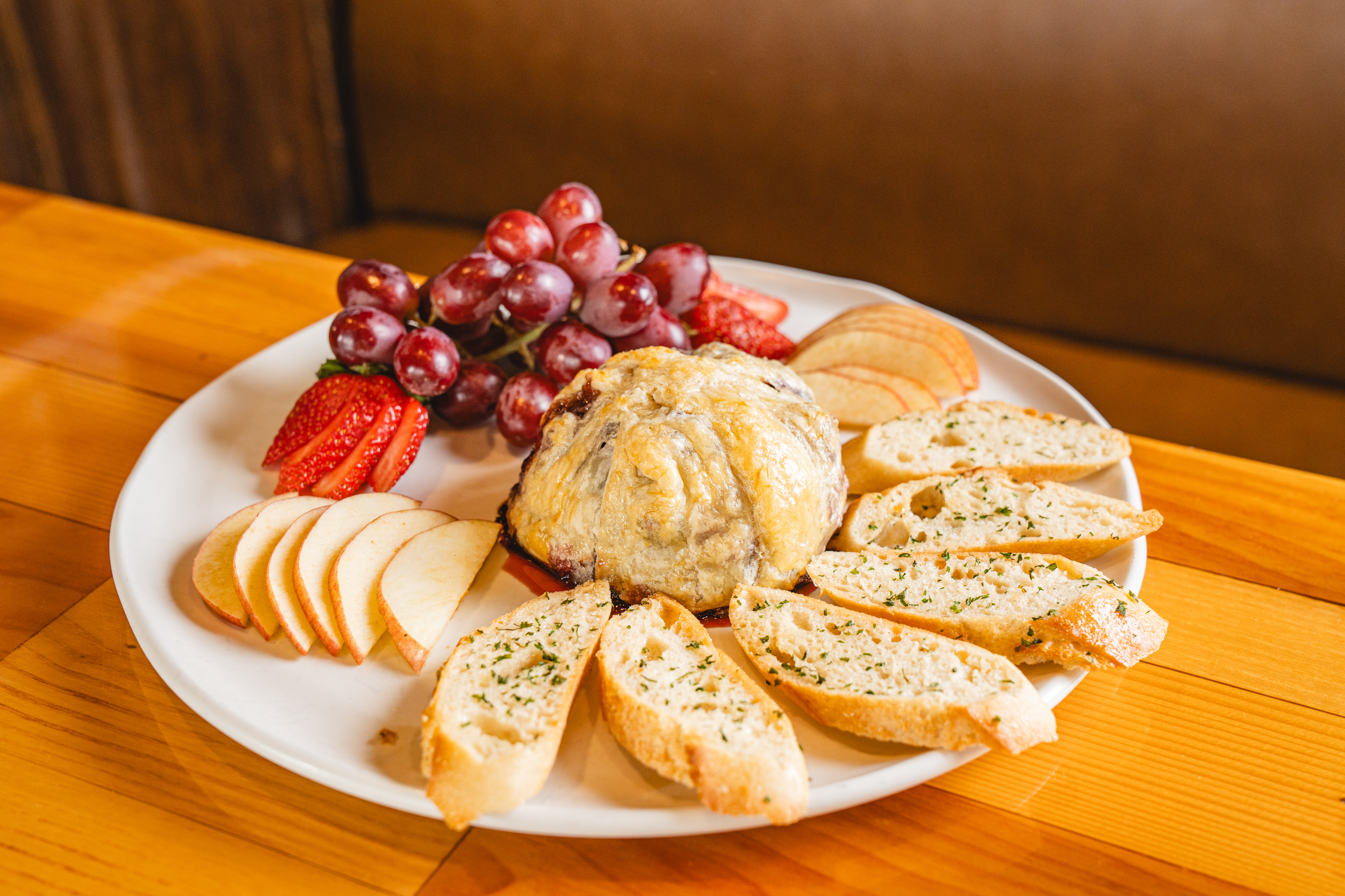 a plate of food sitting on top of a wooden table