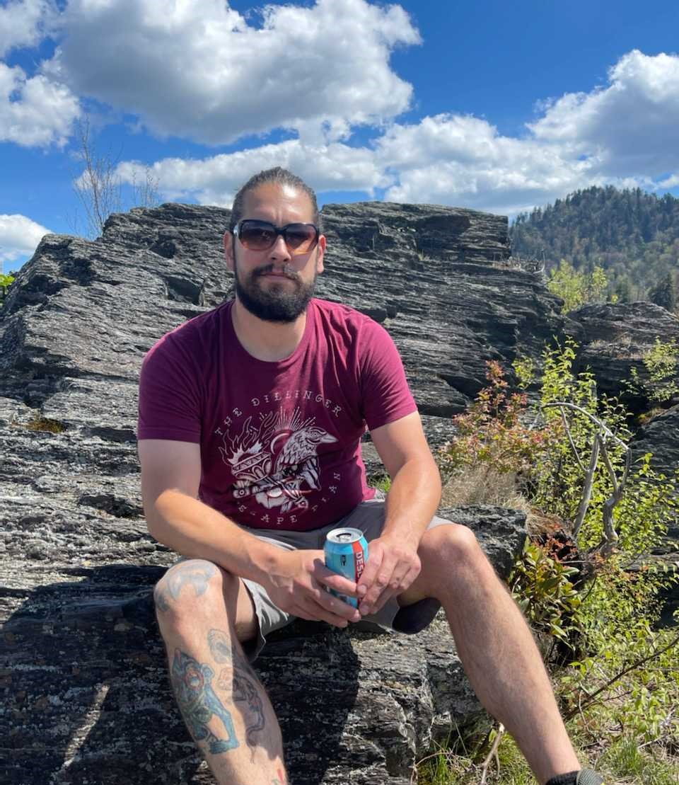 a man sitting on a rock