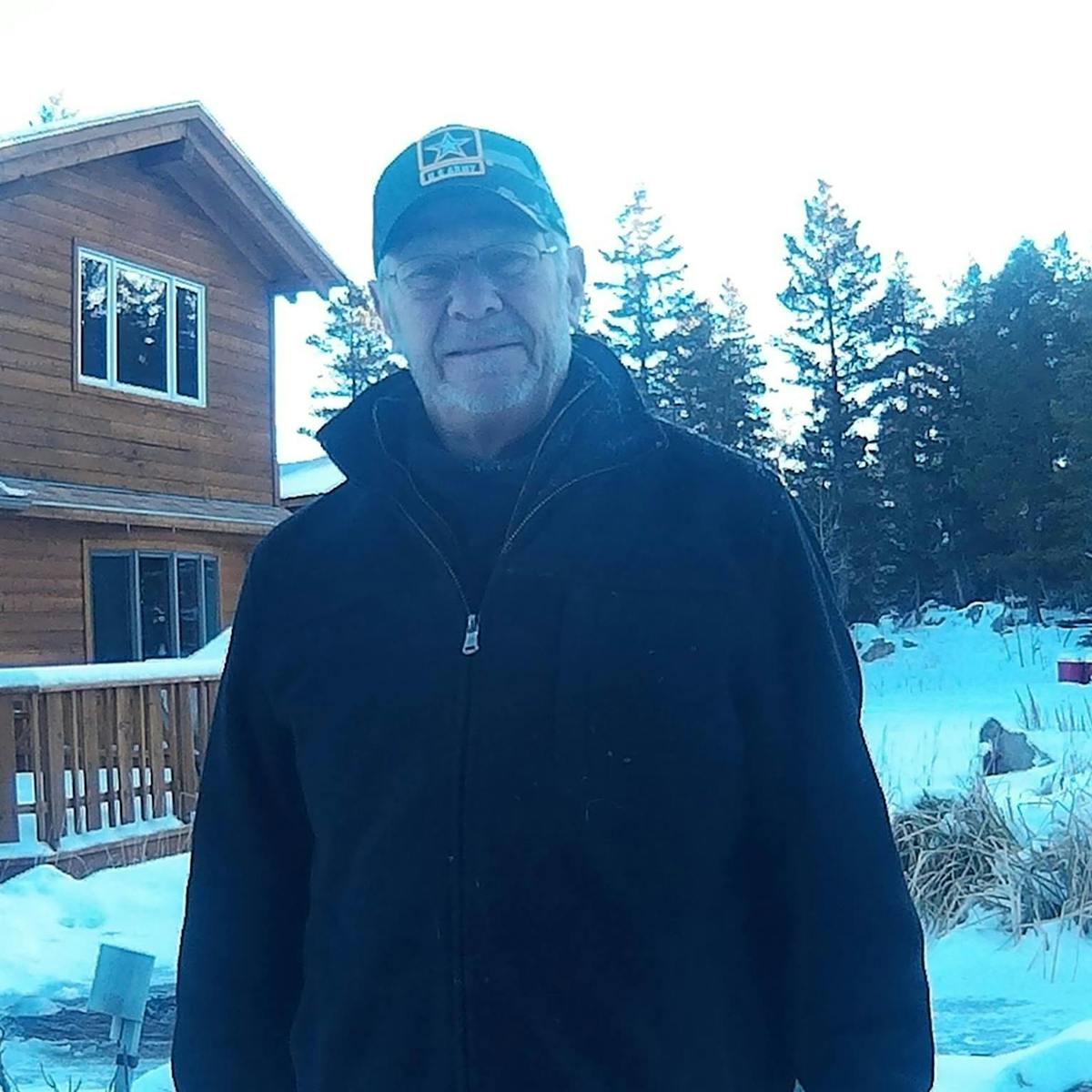 a man that is standing in the snow