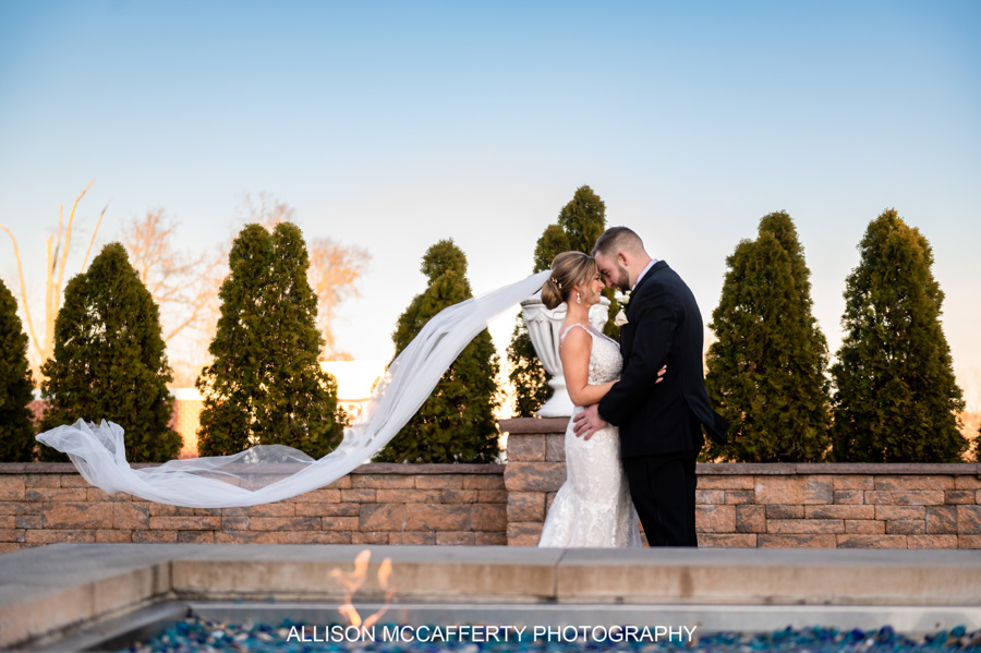a man standing in front of a bridge