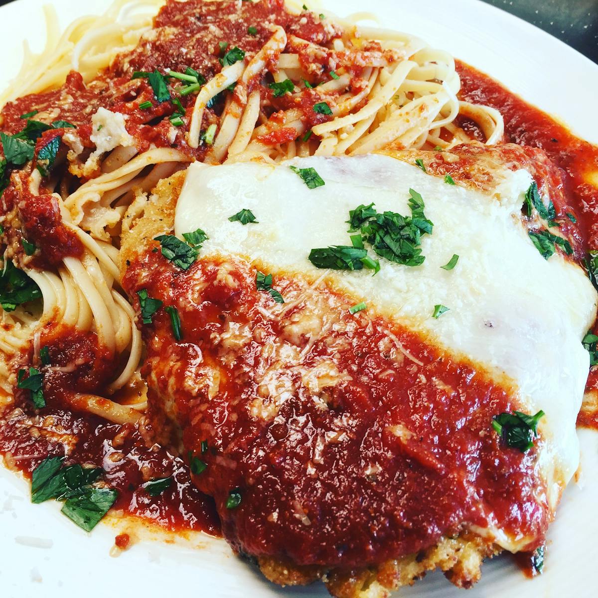 a close up of a plate of food with a slice of pizza