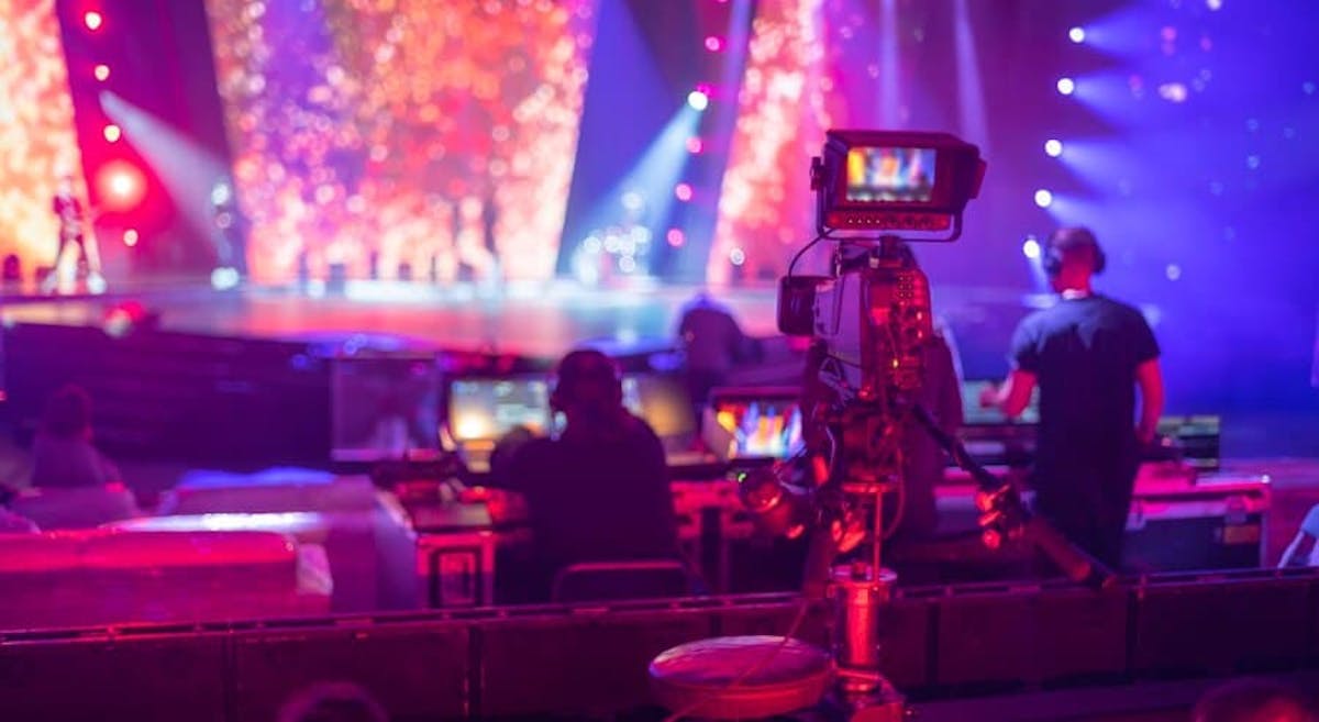 a person sitting on a stage