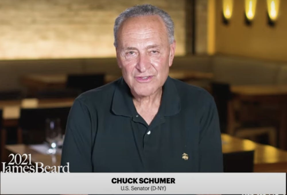 Chuck Schumer sitting at a table