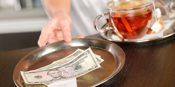 a person holding a cup