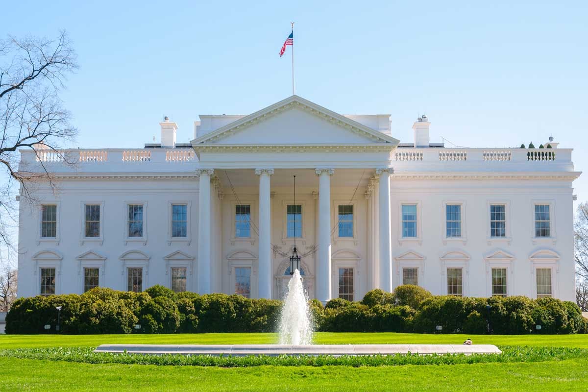 a large building in the background with White House in the background