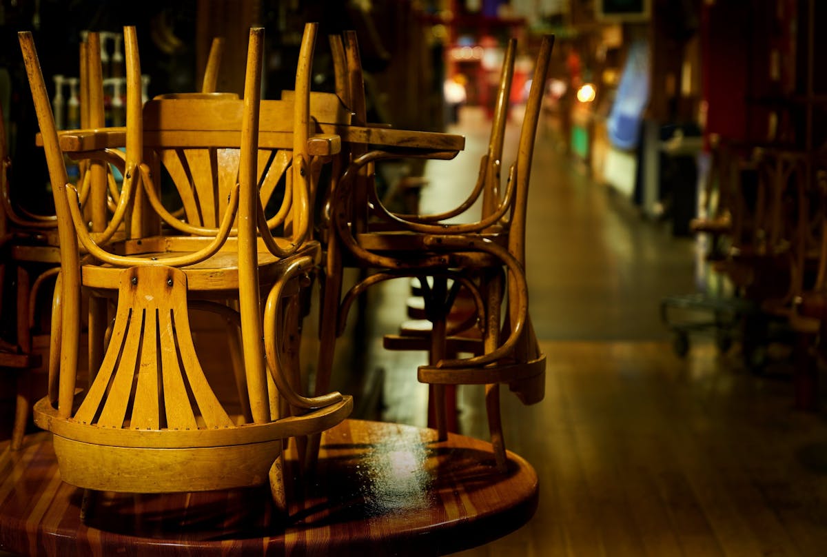 a chair sitting in front of a wooden table