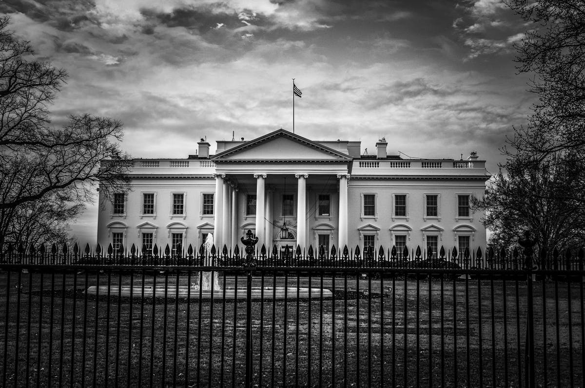 a large clock tower towering over White House