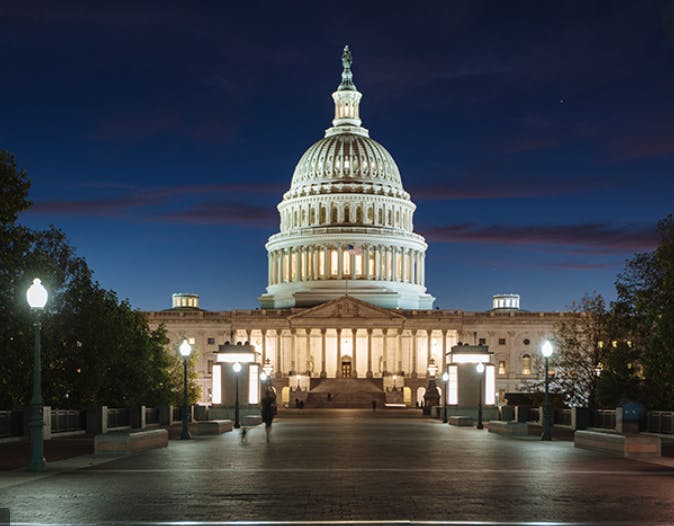 a large building with United States Capitol in the background