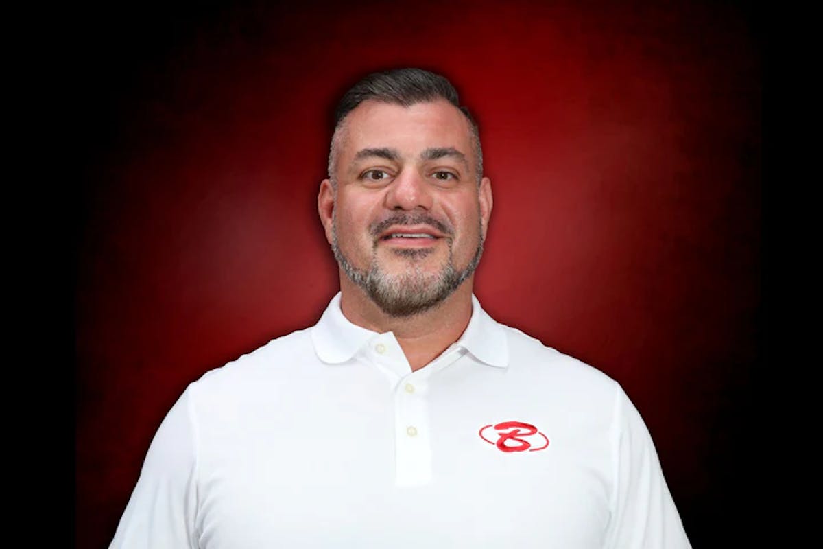 a man posing with a white shirt