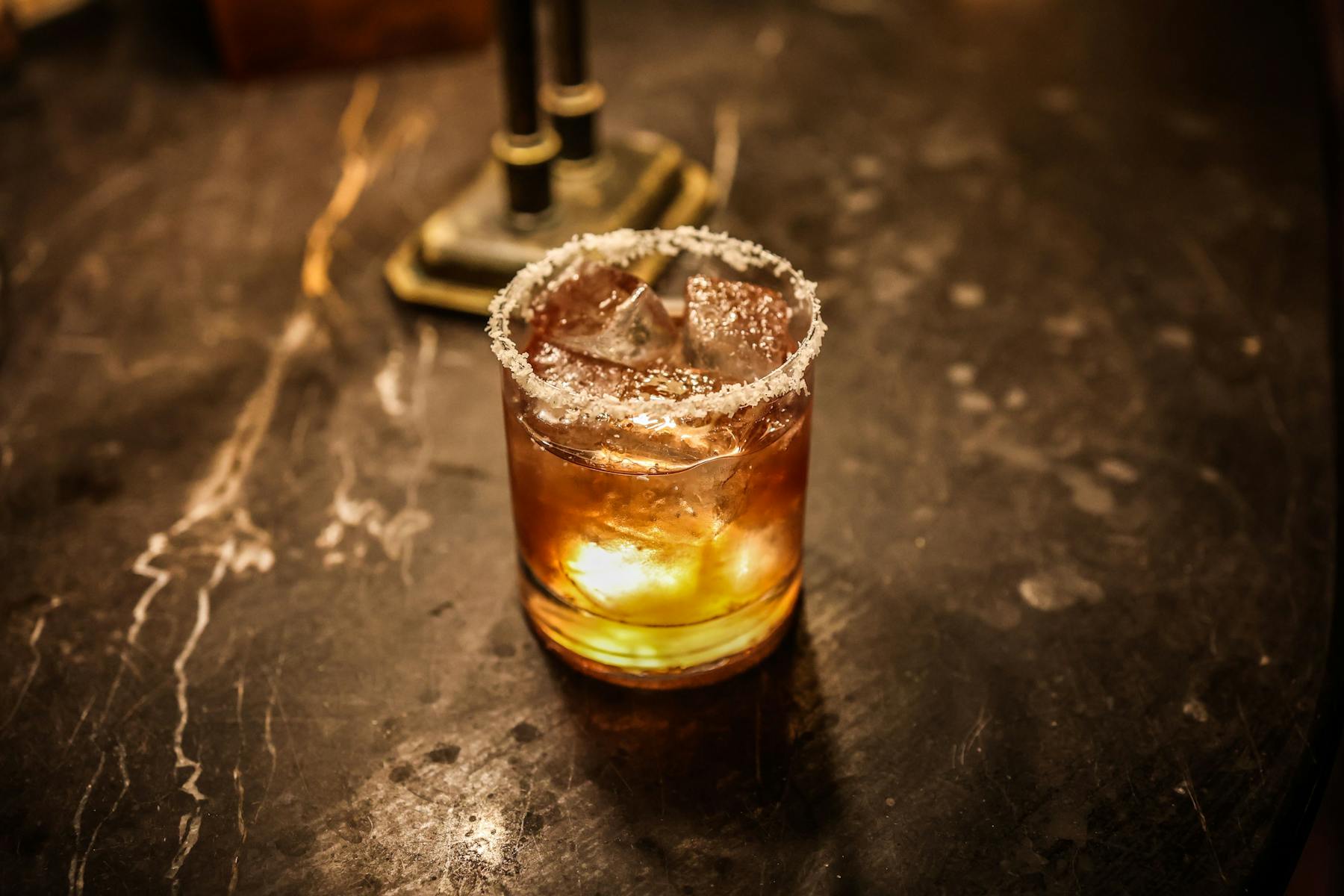 a close up of a glass of beer on a table